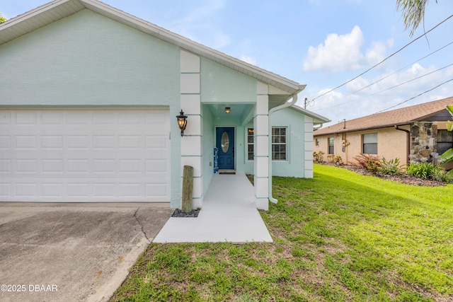 805 Spruce St, New Smyrna Beach, FL 32168 - view of front of house with stucco siding, a front yard, an attached garage, and driveway