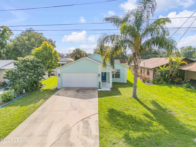 805 Spruce St, New Smyrna Beach, FL 32168 - view of front facade featuring driveway, a garage, a front lawn, and stucco siding