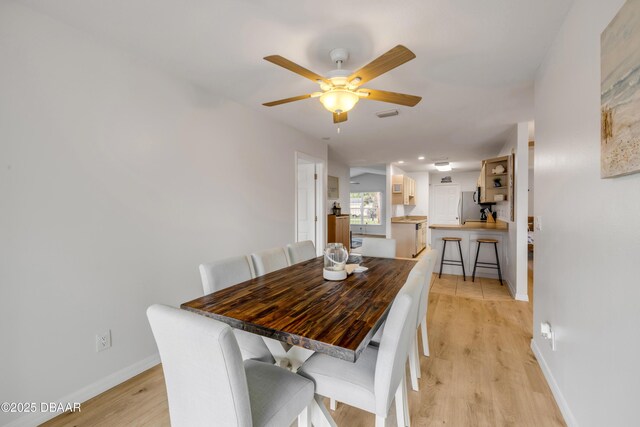 805 Spruce St, New Smyrna Beach, FL 32168 - dining area featuring light wood-style flooring, a ceiling fan, and recessed lighting