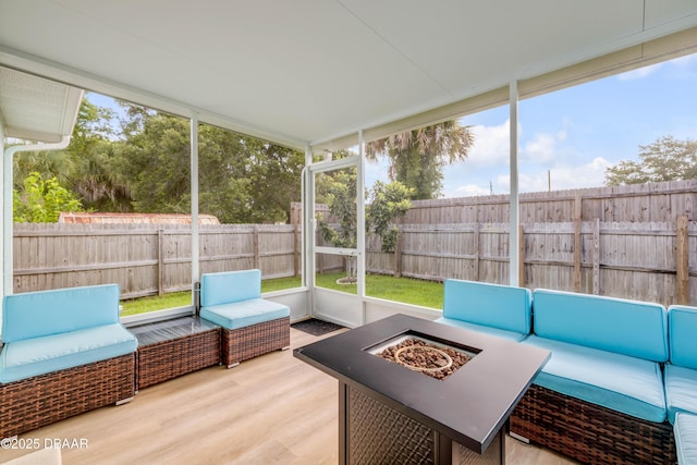 805 Spruce St, New Smyrna Beach, FL 32168 - sunroom / solarium featuring an outdoor living space with a fire pit and healthy amount of natural light