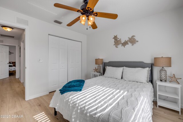 805 Spruce St, New Smyrna Beach, FL 32168 - bedroom featuring light wood-style flooring, a closet, and ceiling fan