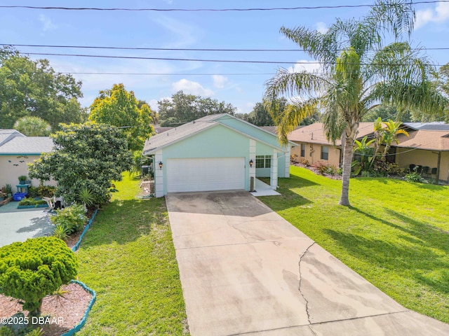 805 Spruce St, New Smyrna Beach, FL 32168 - view of front of house with a front yard, stucco siding, concrete driveway, and a garage
