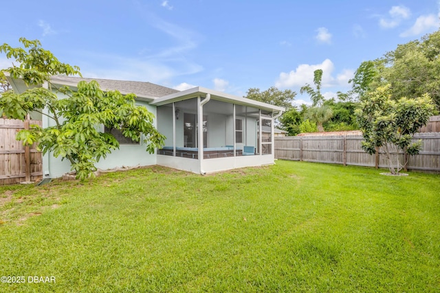 805 Spruce St, New Smyrna Beach, FL 32168 - rear view of house with a sunroom and a fenced backyard