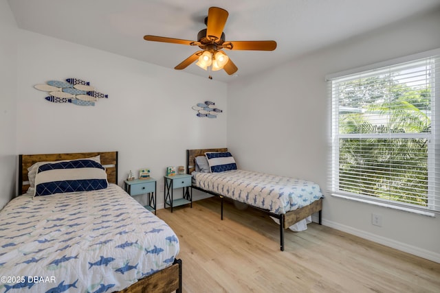 805 Spruce St, New Smyrna Beach, FL 32168 - bedroom featuring light wood finished floors and a ceiling fan
