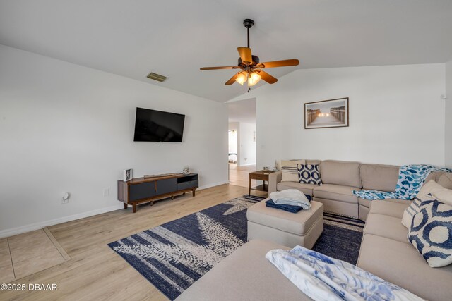 805 Spruce St, New Smyrna Beach, FL 32168 - living area with vaulted ceiling, wood finished floors, and a ceiling fan