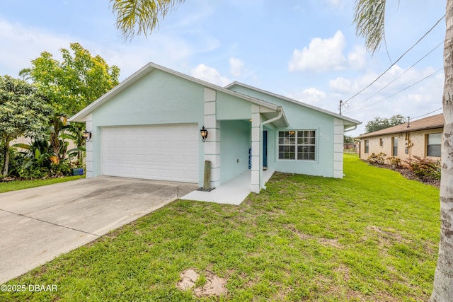 805 Spruce St, New Smyrna Beach, FL 32168 - view of front of home with a garage, stucco siding, driveway, and a front yard