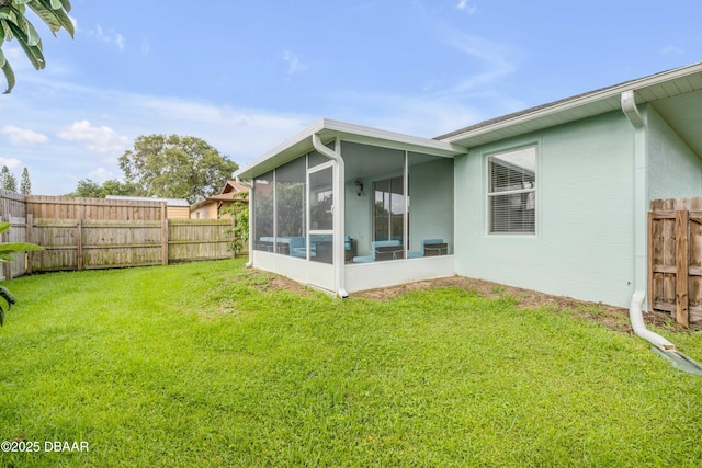 805 Spruce St, New Smyrna Beach, FL 32168 - fenced backyard featuring a sunroom