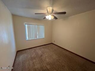 carpeted empty room with ceiling fan