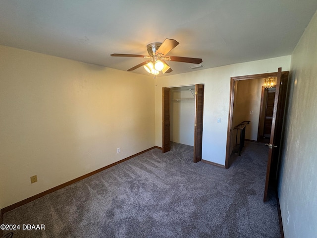 unfurnished bedroom with a closet, dark carpet, and ceiling fan