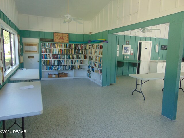 living area with ceiling fan