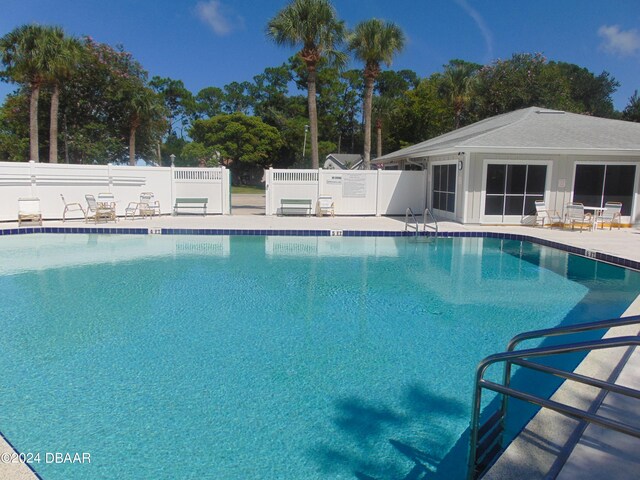 view of pool featuring a patio