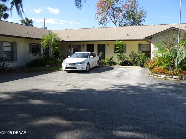 ranch-style house with stucco siding