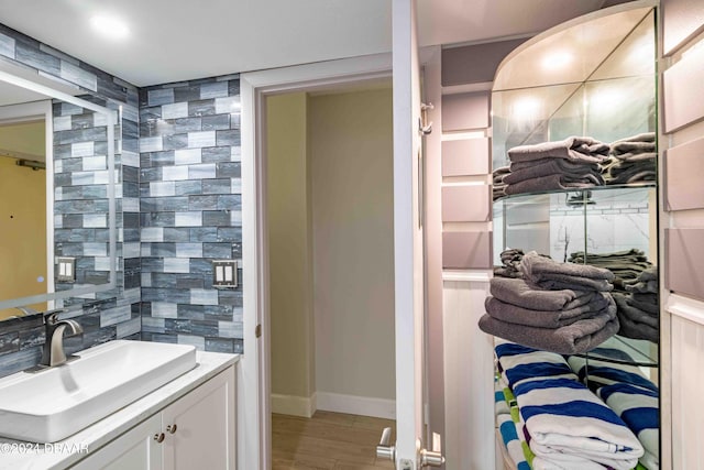 bathroom with vanity and wood-type flooring