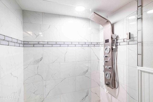 bathroom with a tile shower