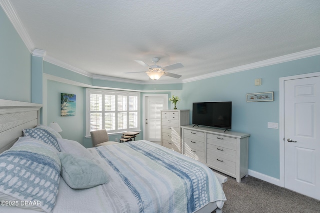 4650 Links Village Dr Unit C-505, Ponce Inlet, FL 32127 - bedroom featuring ornamental molding, dark carpet, baseboards, ceiling fan, and a textured ceiling
