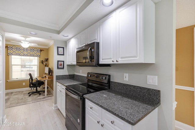 4650 Links Village Dr Unit C-505, Ponce Inlet, FL 32127 - kitchen featuring range with electric stovetop, ornamental molding, black microwave, light wood-style flooring, and white cabinetry
