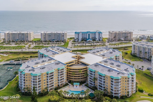 4650 Links Village Dr Unit C-505, Ponce Inlet, FL 32127 - drone / aerial view of apartment complex / building, a large body of water, and a pool area