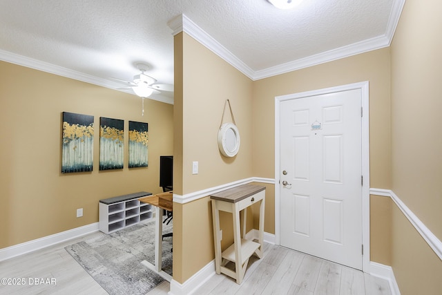 4650 Links Village Dr Unit C-505, Ponce Inlet, FL 32127 - entryway with wood finished floors, a textured ceiling, ornamental molding, a ceiling fan, and baseboards