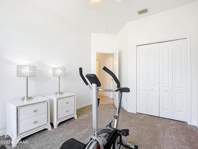 exercise area featuring ceiling fan and light carpet