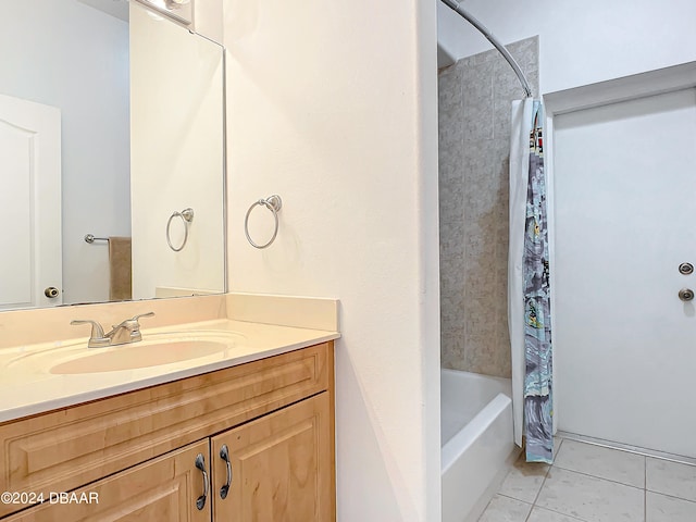 bathroom featuring vanity, tile patterned flooring, and shower / bathtub combination with curtain