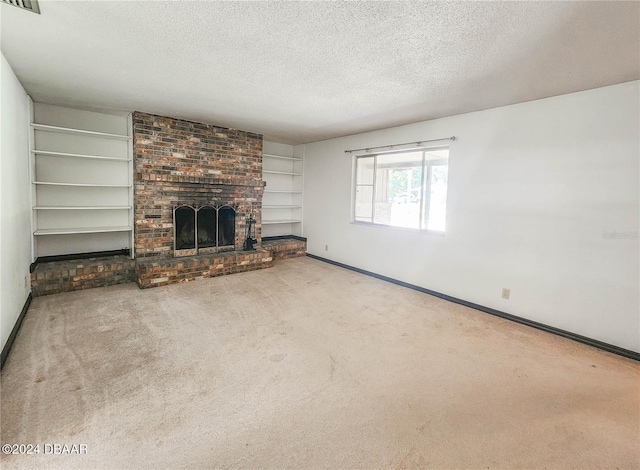 1119 Indigo Rd, Ormond Beach, FL 32174 - unfurnished living room with a textured ceiling, baseboards, carpet floors, a brick fireplace, and built in features