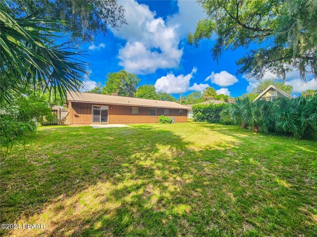 1119 Indigo Rd, Ormond Beach, FL 32174 - view of grassy yard with a patio area