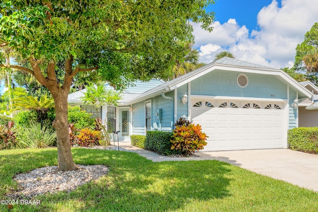 ranch-style home with a garage and a front yard