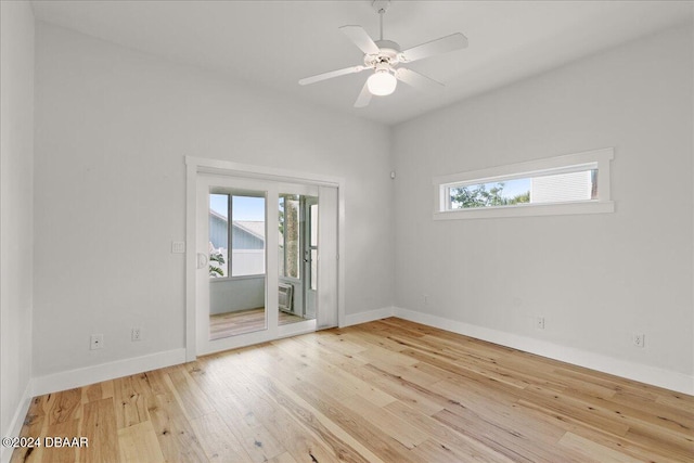 spare room featuring light wood-type flooring and ceiling fan