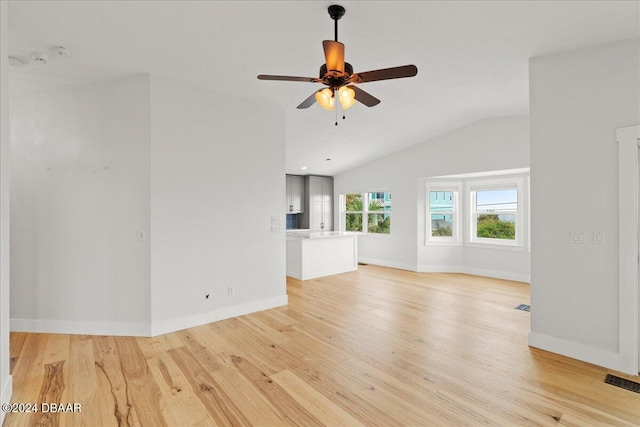 unfurnished living room with light hardwood / wood-style floors, ceiling fan, and lofted ceiling