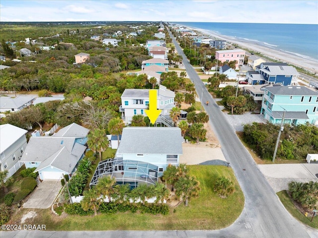 bird's eye view with a water view and a view of the beach