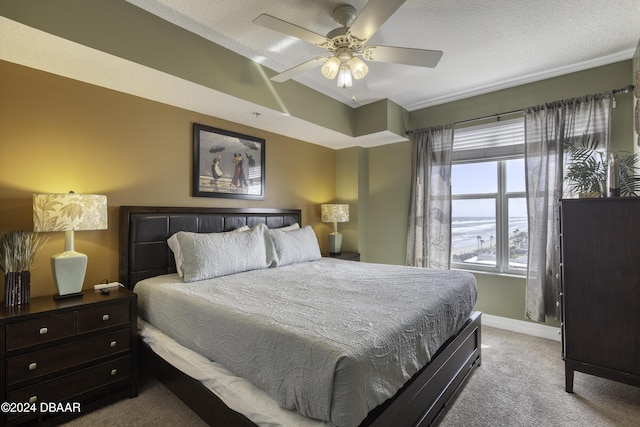 2071 S Atlantic Ave Unit 605, Daytona Beach, FL 32118 - bedroom with light carpet, baseboards, and ceiling fan