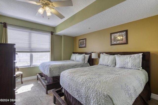 2071 S Atlantic Ave Unit 605, Daytona Beach, FL 32118 - bedroom featuring carpet, baseboards, a textured ceiling, and ceiling fan