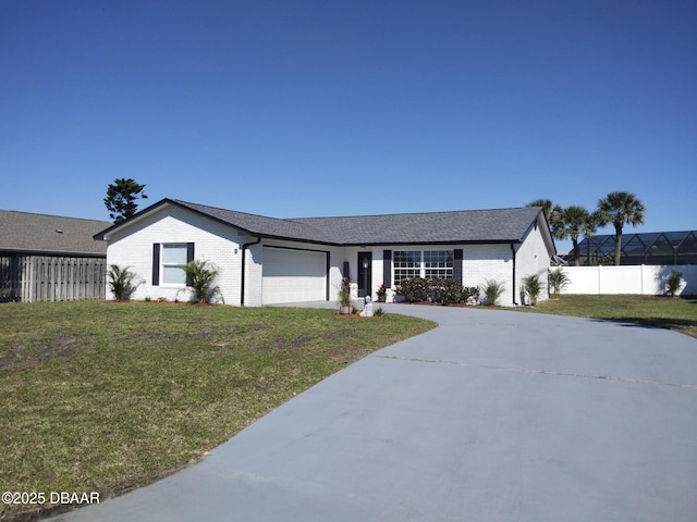 3 Sea Watch Ter, Ormond Beach, FL 32176 - view of front of property with a garage, concrete driveway, a front lawn, and fence