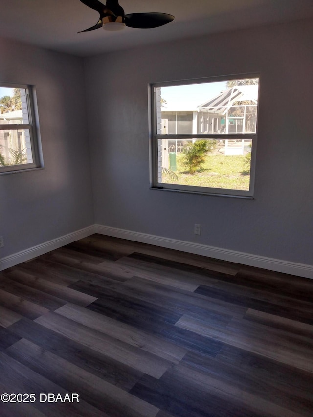 3 Sea Watch Ter, Ormond Beach, FL 32176 - unfurnished room with dark wood finished floors, a healthy amount of sunlight, a ceiling fan, and baseboards