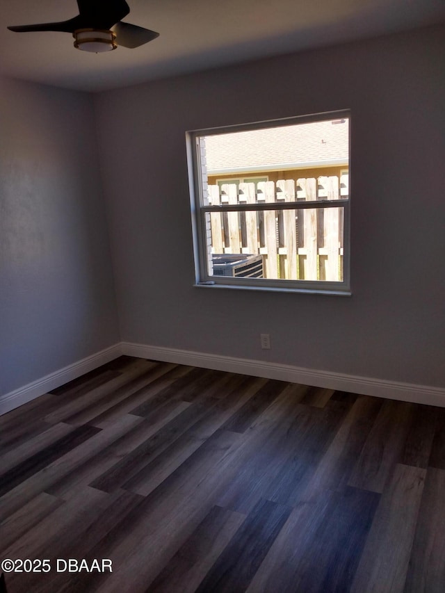 3 Sea Watch Ter, Ormond Beach, FL 32176 - unfurnished room with baseboards, dark wood-style flooring, and a ceiling fan