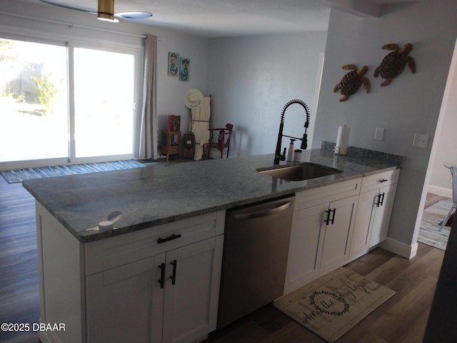 3 Sea Watch Ter, Ormond Beach, FL 32176 - kitchen featuring dishwasher, white cabinets, stone countertops, and a sink