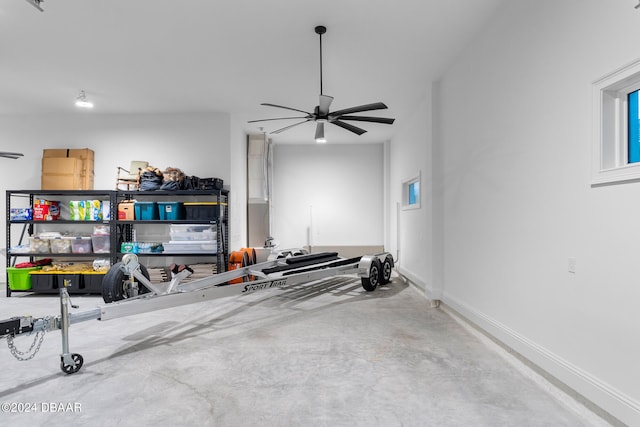 interior space featuring concrete flooring and ceiling fan