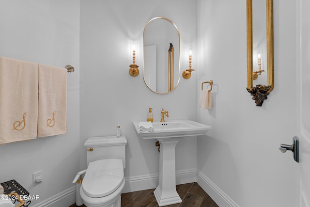 bathroom featuring toilet and hardwood / wood-style floors