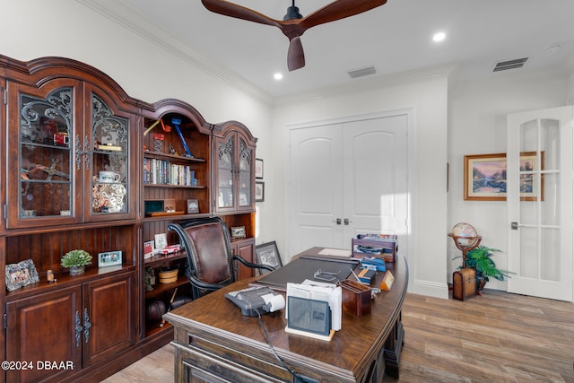 office space featuring ceiling fan, light hardwood / wood-style flooring, and ornamental molding