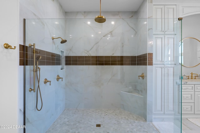 bathroom featuring vanity and a tile shower