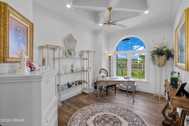 office featuring coffered ceiling, ornamental molding, dark hardwood / wood-style floors, ceiling fan, and beam ceiling