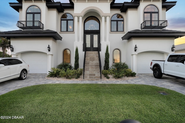 view of front of house with a garage and a front yard