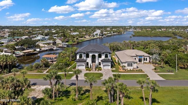 birds eye view of property with a water view