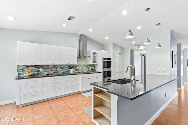 kitchen featuring open shelves, visible vents, double oven, a sink, and wall chimney exhaust hood