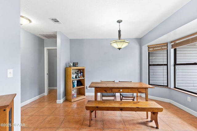 dining area with visible vents, baseboards, and light tile patterned floors