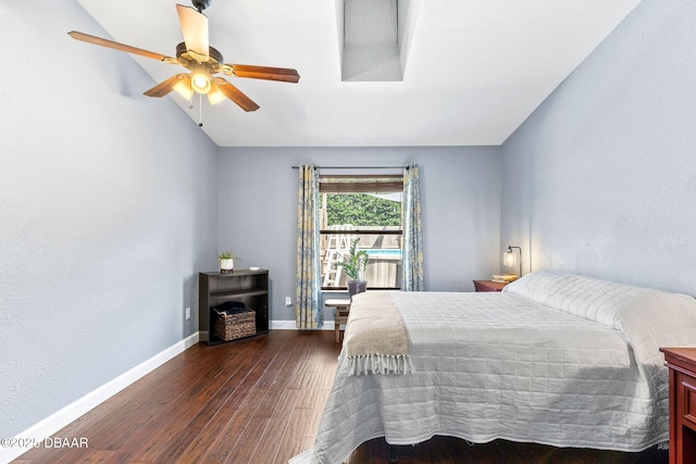 bedroom featuring ceiling fan, baseboards, and dark wood finished floors