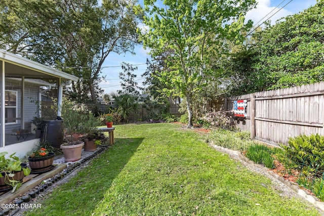 view of yard with a fenced backyard