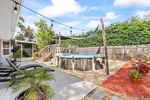 view of pool with a fenced backyard and a fenced in pool