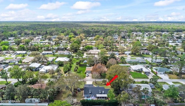 aerial view with a residential view and a view of trees