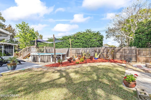 view of yard featuring a fenced in pool, a sunroom, a fenced backyard, and a patio